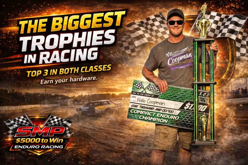 Enduro racing winner Nate Coopman holding a large trophy in victory lane at SMP Enduro Racing in Southern Minnesota with $5,000 to win dirt track event.